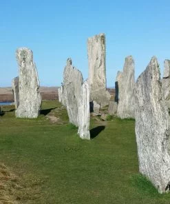 Standing Stones of Callanish in bright sunshine with blue sky taken on our Hebrides – Two Day Tour