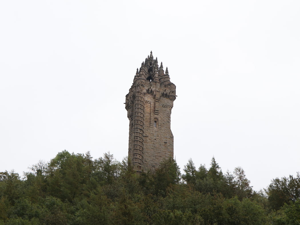 Above us, against a white sky and on top of a wooded hill is a large ornate tower dating from the mid-1800s. This Wallace Monument, on the Stirling Castle Tour, is four floors high.